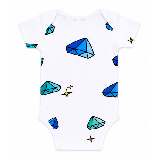 The back image of a Babydrip White short-sleeve baby bodysuit onesie with a pattern of colorful blue and green gemstones and small yellow sparkle stars, with ribbed shoulders and neck seam, shown laying flat on a white background.
