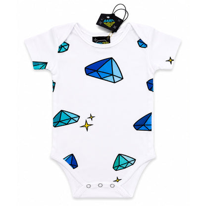 A babydrip white short-sleeve baby bodysuit onesie featuring a playful print of blue and teal diamonds and small yellow sparkles, with safety snap button closure at the bottom of the onesie. The onesie is shown laid flat on a white background with its black hangtag attached to the inside of the neck rim.