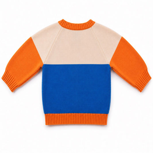 Image of the back of a Babydrip color block toddler boy knit sweater with a hot livewire cream and blue body, orange sleeves and orange ribbed trim on the neckline, cuffs, and hem, laid out flat on a white background.