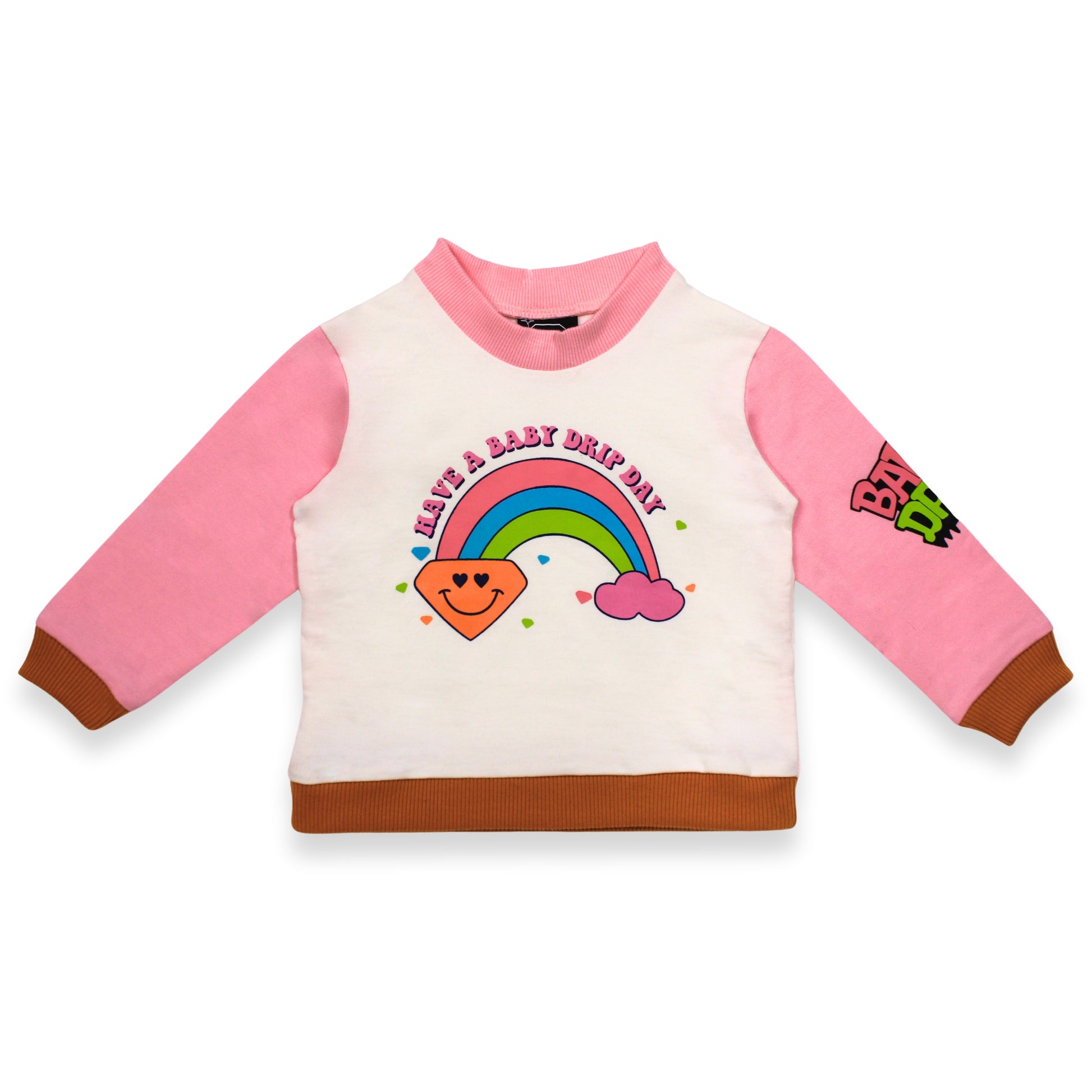 A Babydrip long-sleeve sweatshirt with a white body, pink sleeves, and brown ribbed hem and cuffs. The front features a colorful graphic of a smiling rainbow, a diamond-shaped sun, and the text 'HAVE A BABY DRIP DAY', while the right sleeve has a 'BABY DRIP' brand patch with a pink round crew neckline laid out on a white background.