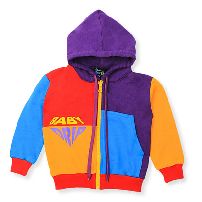 A Babydrip colorful zip-up hoodie for boys with a colorblock design in purple, red, blue, and orange. The front features a yellow graphic text reading 'BABY DRIP' and a yellow zipper with purple drawstrings with red ribbed cuffs and hem.