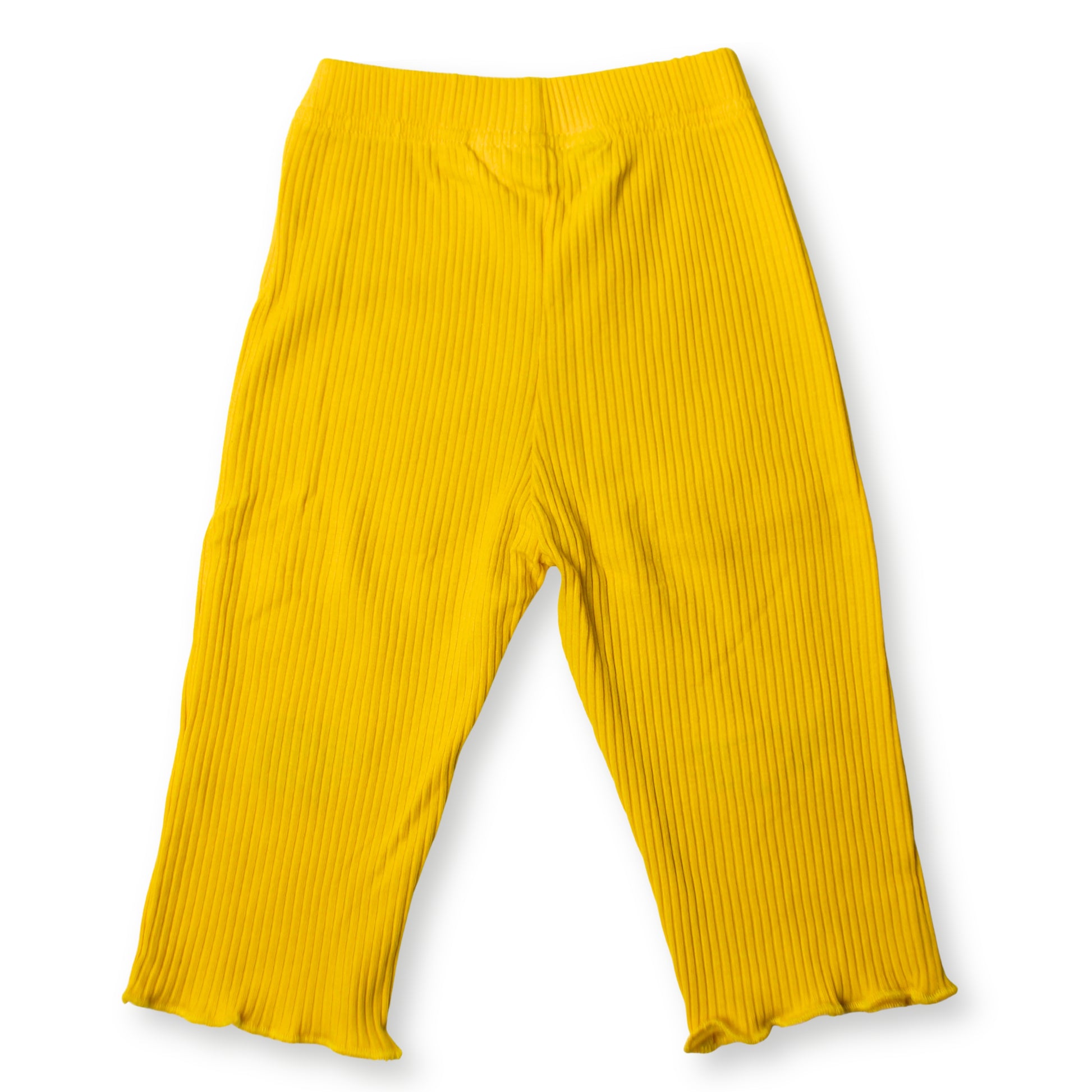 Image of the back section of a Babydrip bright yellow ribbed knit pants with a wide elastic waistband and ruffled hems, shown flat against a white background.