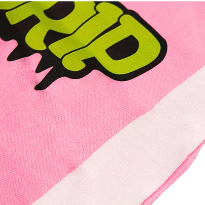 A close-up image of a Babydrip garment featuring pink terry cotton fabric with a large lime green and black graphic print and a white diagonal stripe laid out flat on a white background.