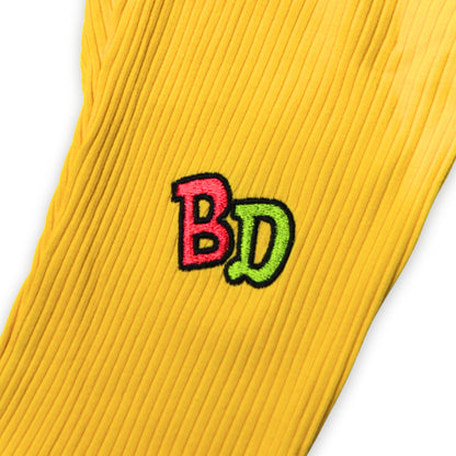 Close up image of embroidered text on the leg of a  babydrip 2-piece pants set for girls.