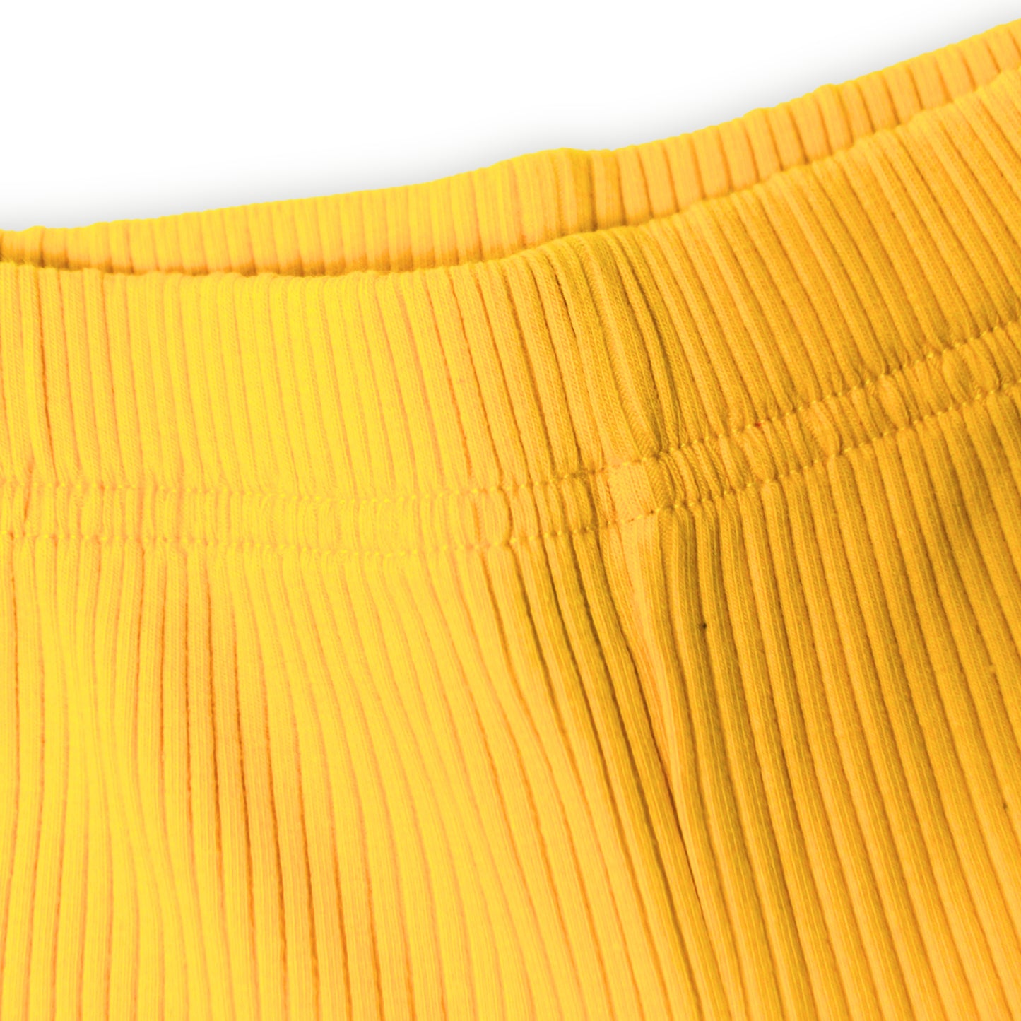 Close-up of a yellow ribbed fabric  texture of a Babydrip 2-piece pants set, on a white background.