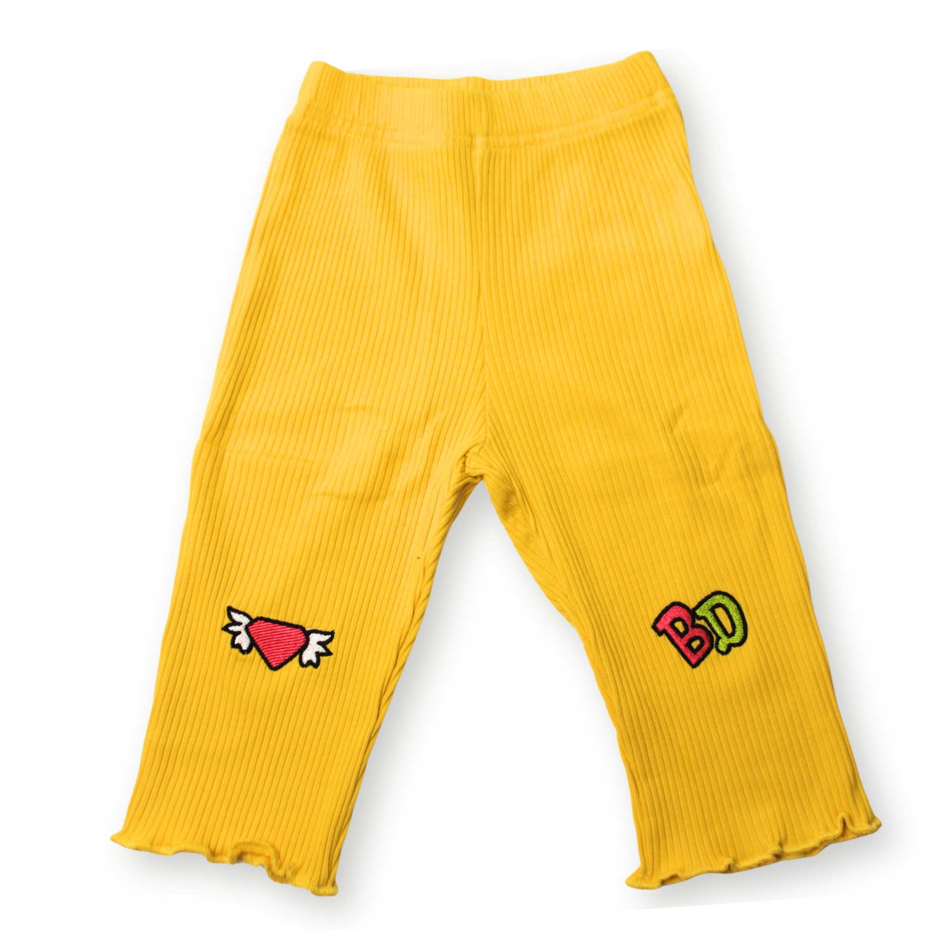 Front image of Babydrip girls' yellow ribbed leggings with an elastic waistband, lettuce-edge hems, and embroidered heart and 'BD' patches.