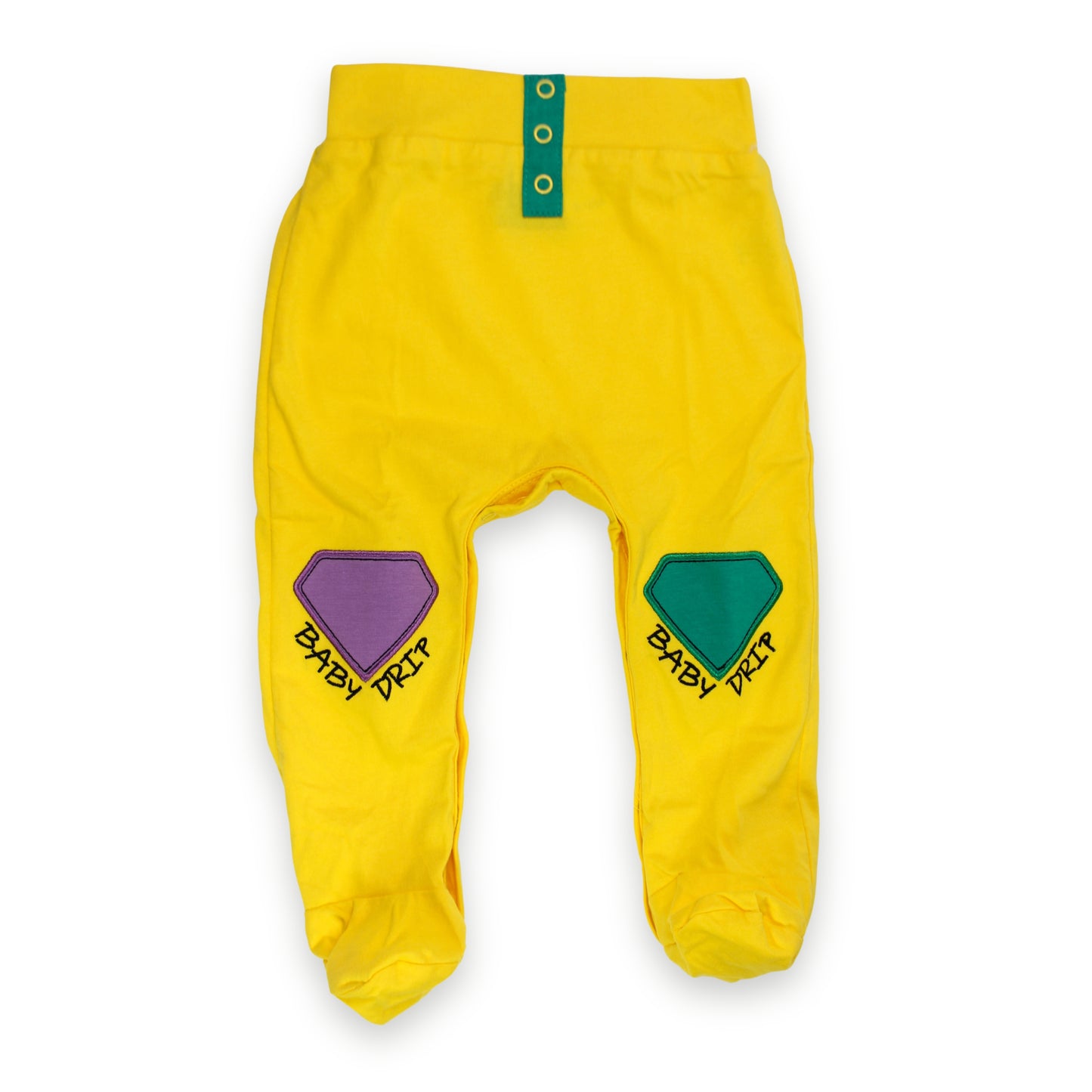 Image of Babydrip bright yellow baby boy pants with green button details at the front of the waist, and a purple embroidered diamond patch on the left leg, and a green embroidered  diamond patch on the right leg, each printed with the words 'BABY DRIP' beneath the tip of each diamond in black text laid flat on a white background.