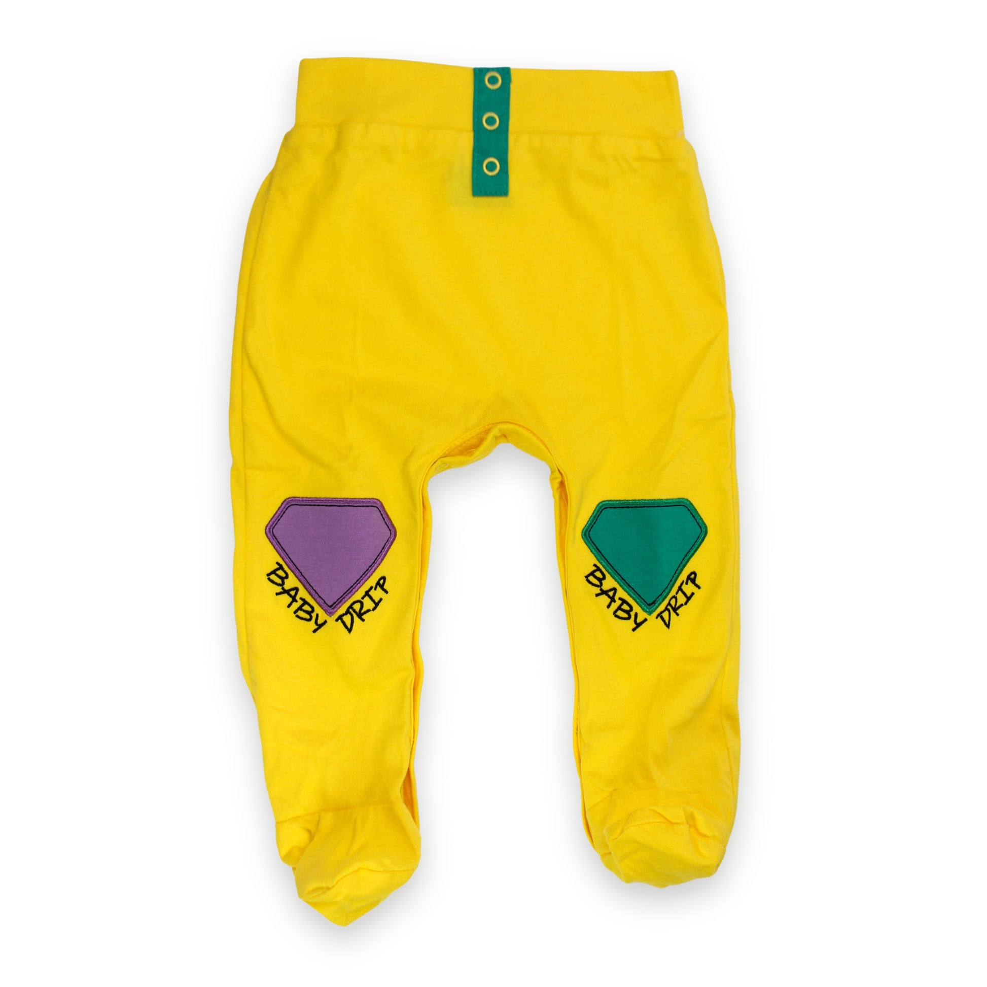 Image of Babydrip bright yellow baby boy pants with green button details at the front of the waist, and a purple embroidered diamond patch on the left leg, and a green embroidered  diamond patch on the right leg, each printed with the words 'BABY DRIP' beneath the tip of each diamond in black text laid flat on a white background.