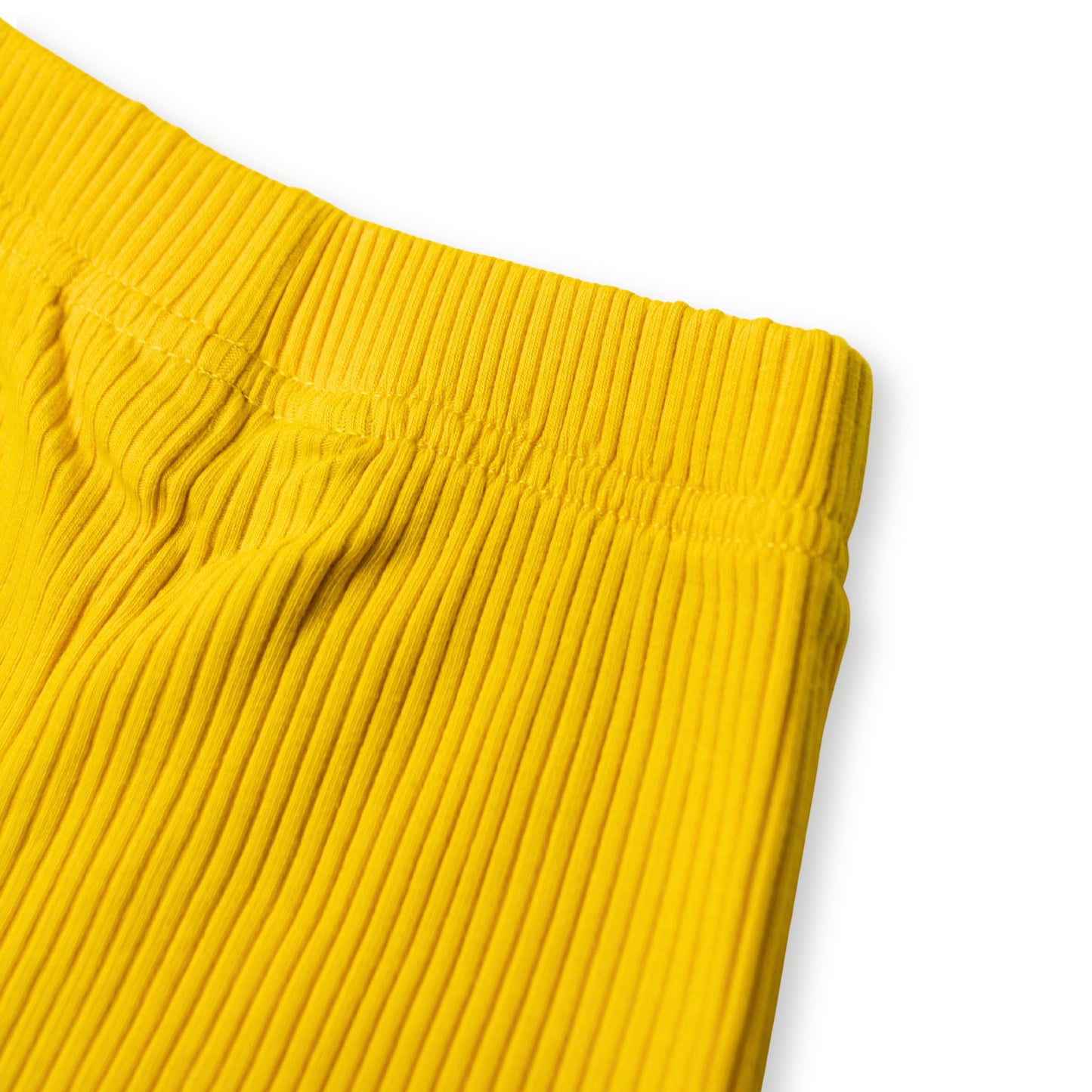 Close-up image of a Babydrip bright yellow ribbed knit garment, showing the waistband and folded fabric texture on a white background.